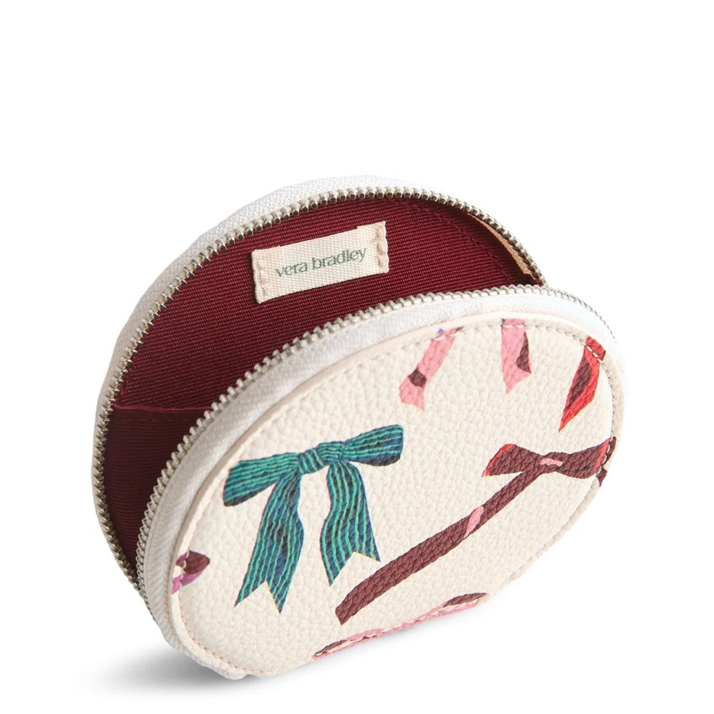 VERA BRADLEY Round Zip Pouch
in Rows of Bows Faux Leather NET MSRP: $39.00